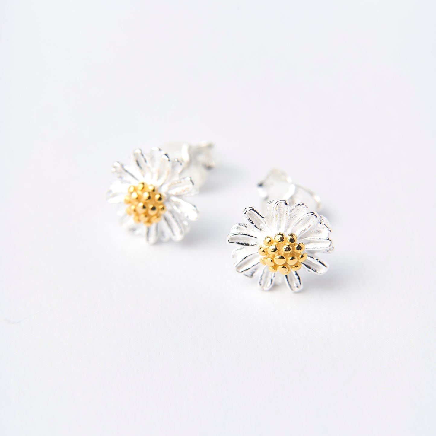 Brincos Daisy