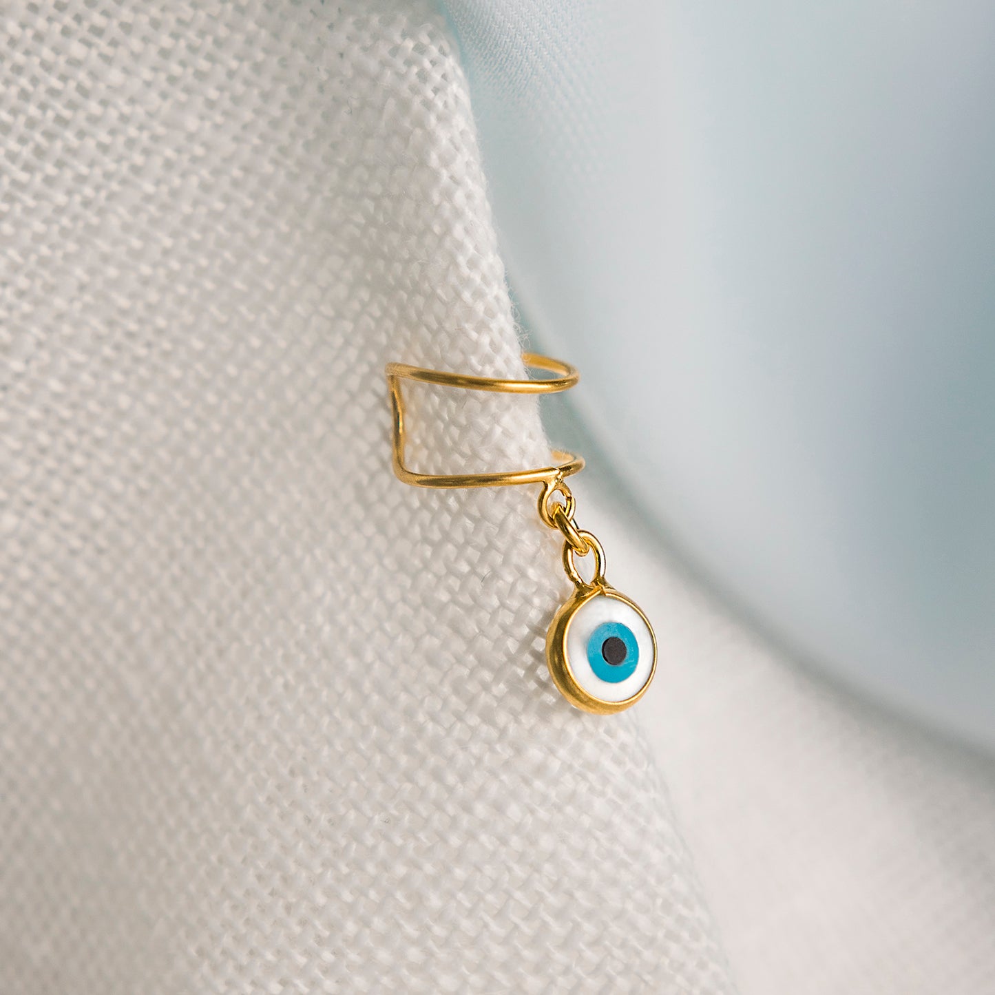 Earcuff Duas Linhas com Olho Turco em Madrepérola