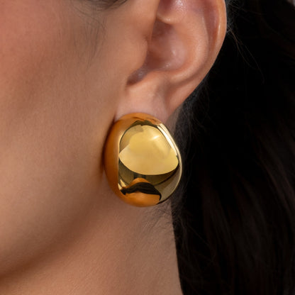 Brincos Golden Hour em aço inoxidável dourado e prateado design orgânico polido coleção Fuse joalharia industrial contemporânea.