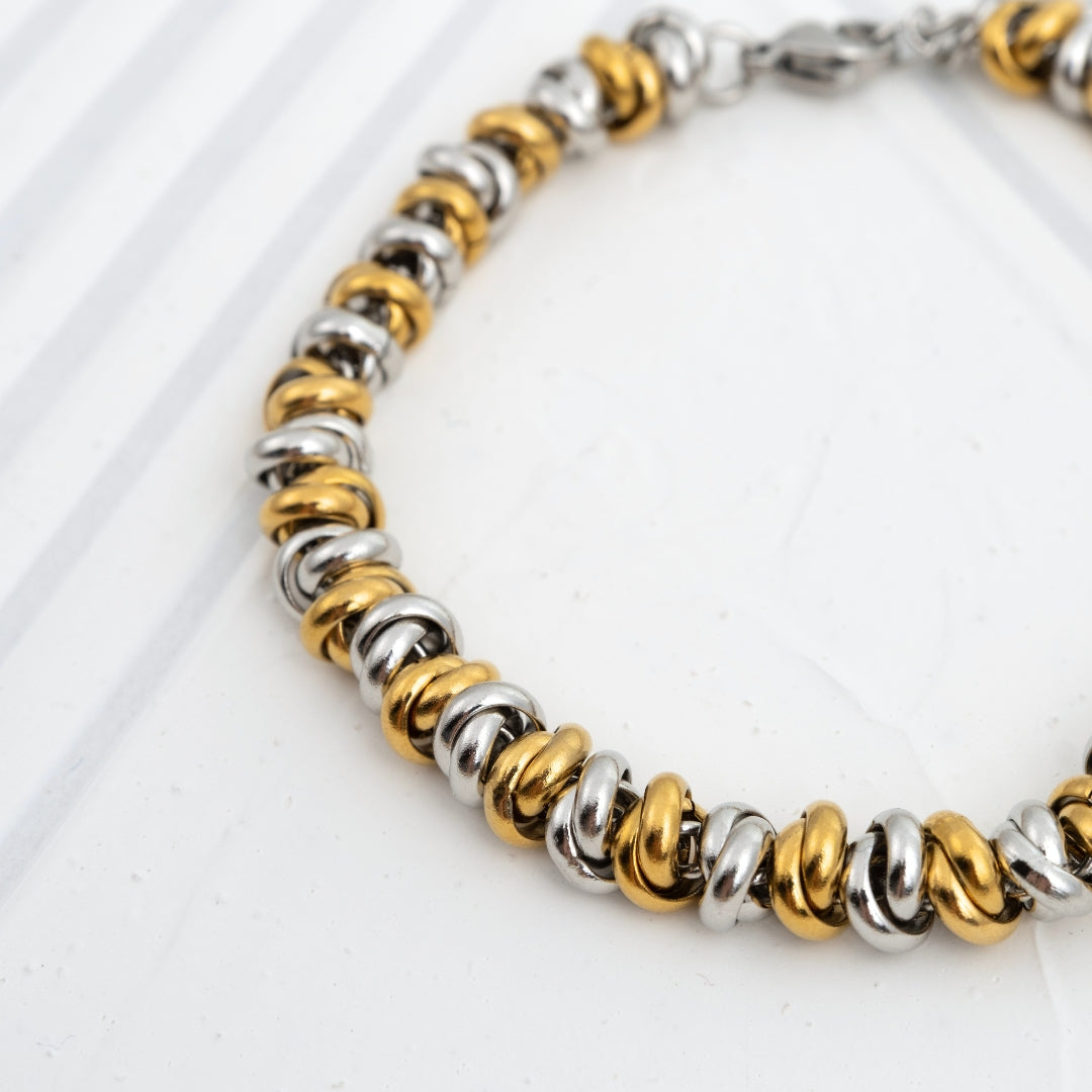 Pulseira Lumi bicolor e dourada em aço inoxidável elos amendoados coleção Fuse resistente à água.