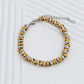 Pulseira Lumi bicolor e dourada em aço inoxidável elos amendoados coleção Fuse resistente à água.
