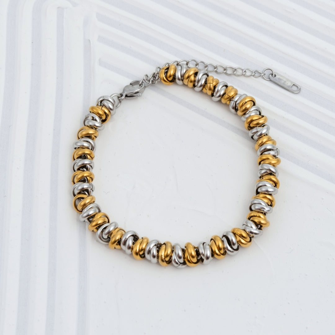 Pulseira Lumi bicolor e dourada em aço inoxidável elos amendoados coleção Fuse resistente à água.
